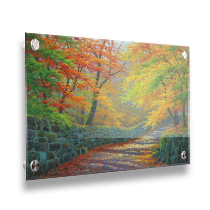 A painting of a stone road through a forest. It is bordered by stone walls on either side. The leaves of the trees are changing colors and dropping to the ground for fall. Printed on acrylic.