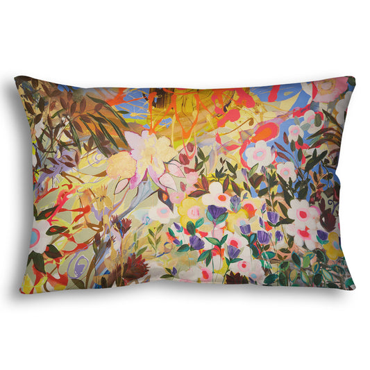 Throw pillow designed with an abstract flower garden utilizing vibrant and bold flat color. Flowers of all shapes, sizes, and colors can be seen against a baby blue sky.