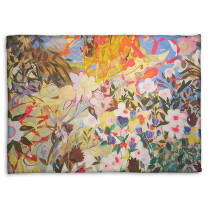 Coral fleece throw blanket designed with an abstract flower garden utilizing vibrant and bold flat color. Flowers of all shapes, sizes, and colors can be seen against a baby blue sky.