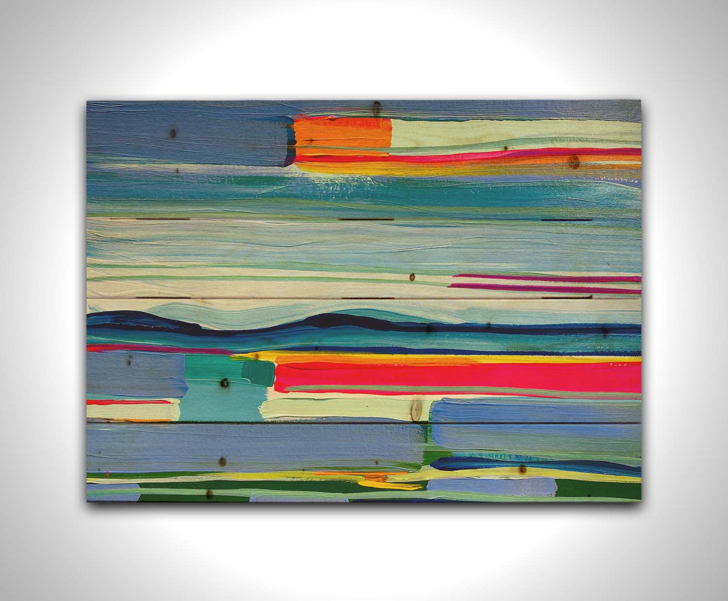 An abstract painting of colorful horizontal lines. The blue and orange are reminiscent of a sun setting over the sea. Printed on a wood pallet.