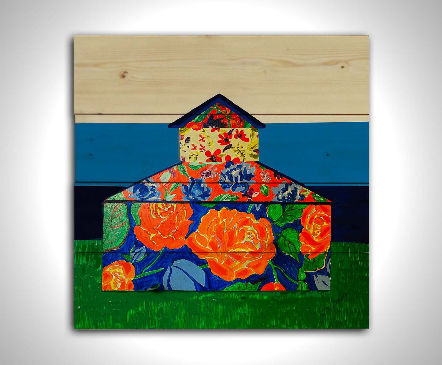 An abstract painting of a barn made up of various floral patterns. It is sitting on a green ground plane with a blue striped background. Printed on a wood pallet.