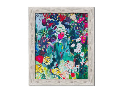 An abstract painting of a deep blue and green garden, accented by bright pinks and yellows, utilizing simplified shaped and flat colors. Printed on canvas and framed.