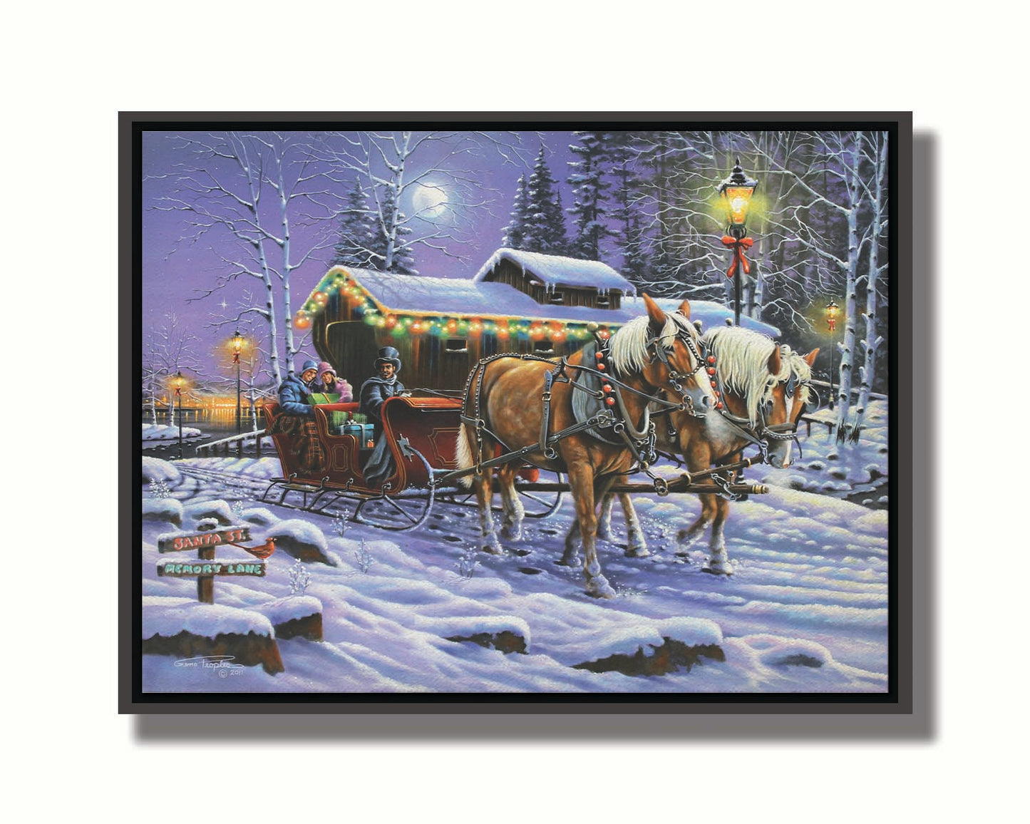 A painting of a horse-drawn sleigh, bringing people through a snowy landscape. They pass buildings around a lake decorated with Christmas lights, and their path is lit by street lamps. Printed on canvas in a float frame.