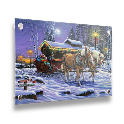 A painting of a horse-drawn sleigh, bringing people through a snowy landscape. They pass buildings around a lake decorated with Christmas lights, and their path is lit by street lamps. Printed on acrylic.