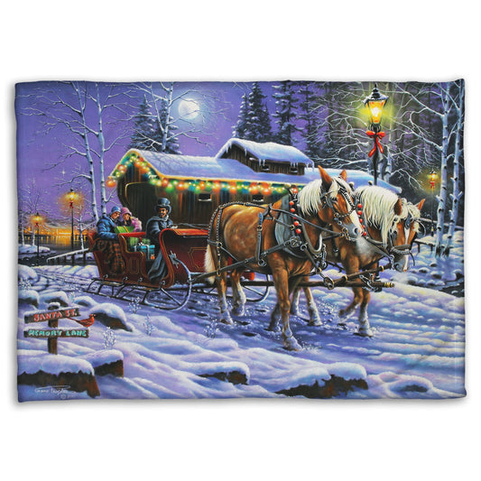 A coral fleece blanket printed with a painting of people on a horse-drawn sleigh ride around a lake during Christmas.