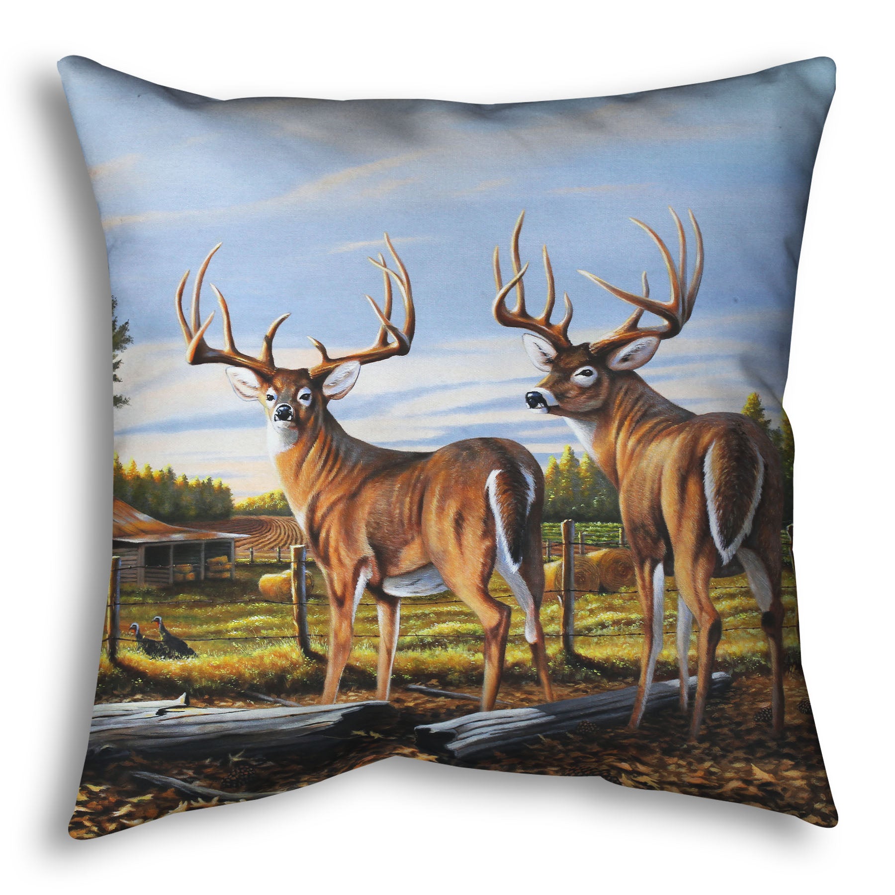A throw pillow designed with a painting of a farm landscape, featuring two deer in the foreground. Fields, buildings, hay bales, and farming equipment can be seen beyond the fence, and fallen leaves cover the ground. 