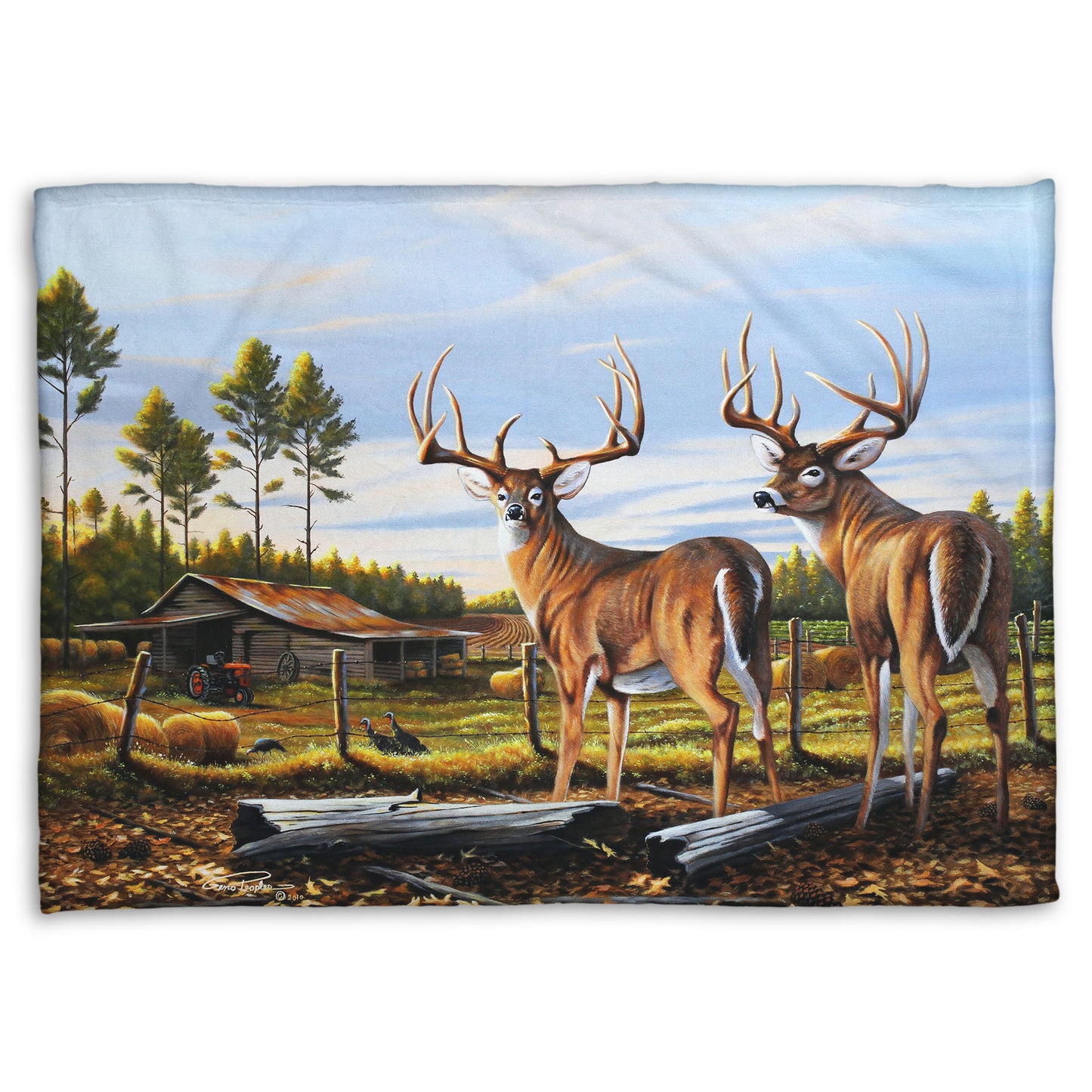 A coral fleece blanket designed with a painting of a farm landscape, featuring two deer in the foreground. Fields, buildings, hay bales, and farming equipment can be seen beyond the fence, and fallen leaves cover the ground. 
