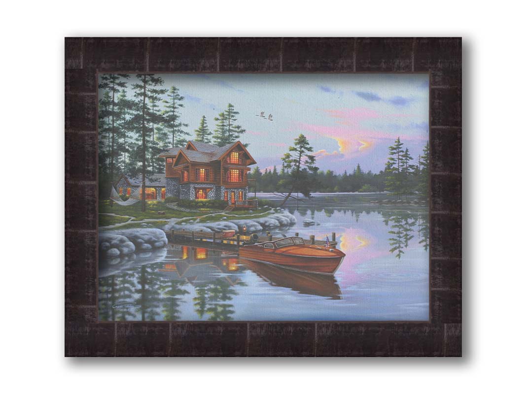 A painting of a lakeside cabin, with a boat out on the water and geese overhead. Printed on canvas and framed.