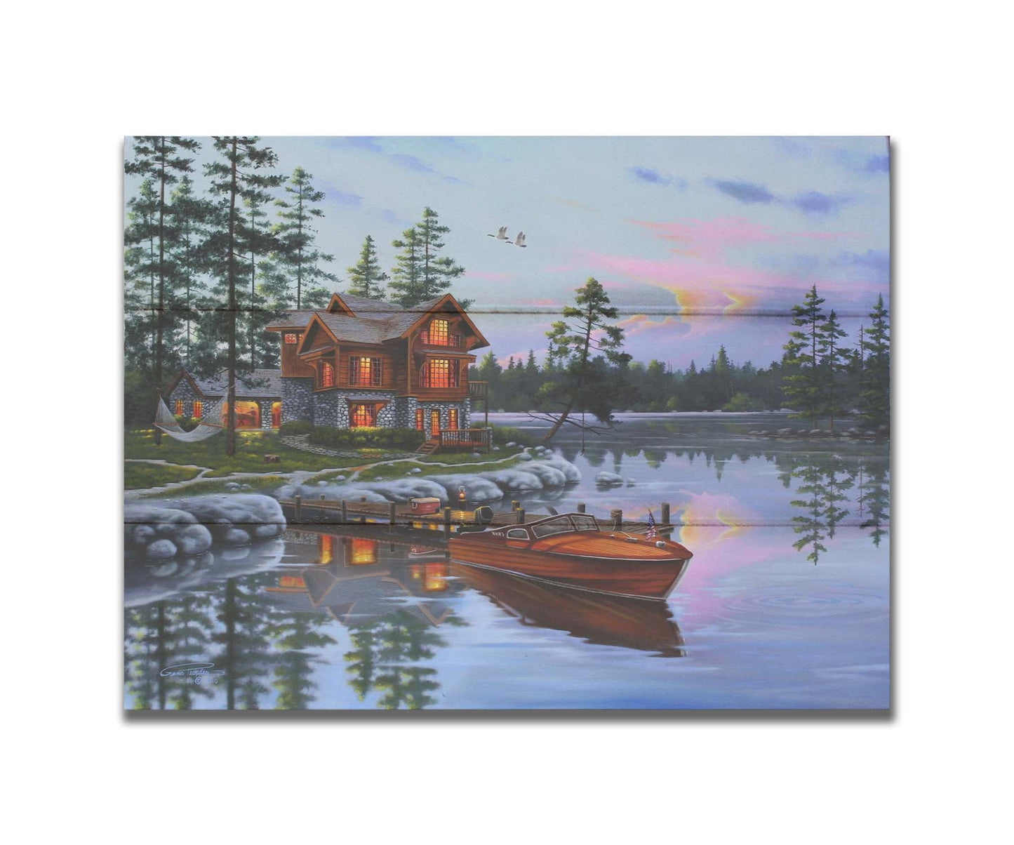 A painting of a lakeside cabin, with a boat out on the water and geese overhead. Printed on a box board.