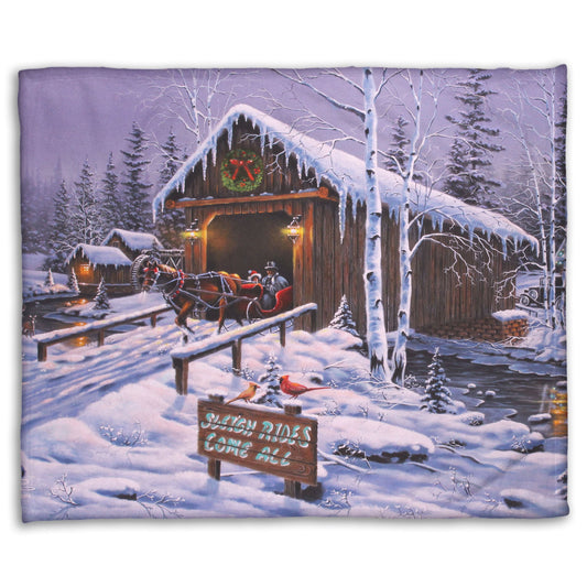 A coral fleece blanket designed with a painting of people going for a ride in a horse-drawn sleigh on a snowy night.