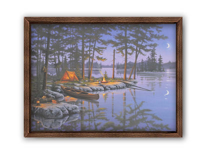 A painting of a small campsite by a forested lake. A canoe sits in the water beside a stone strewn with fishing gear. The night sky reflects off the water in purples and blues. Printed on canvas and framed.