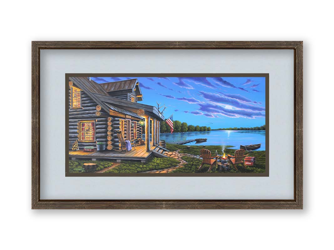 A painting of a lakeside cabin at moonrise. A stone path leads from the porch to a small campfire, as well as down to a dock where canoes rest on the water. Printed on paper, matted, and framed.