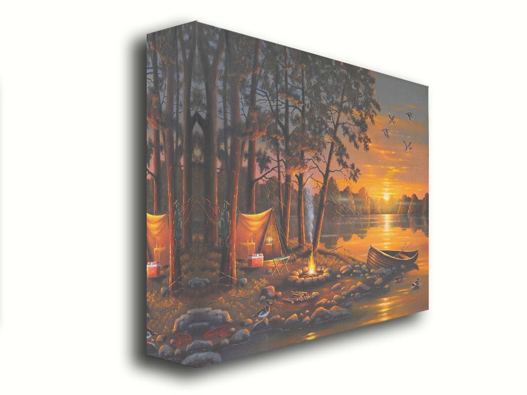 A painting of a small woods campsite at the edge of a lake. A boat is docked on the rocks of the shore, and a campfire is lit nearby. Some ducks swim in the lake as others fly overhead before the setting sun. Printed on canvas.