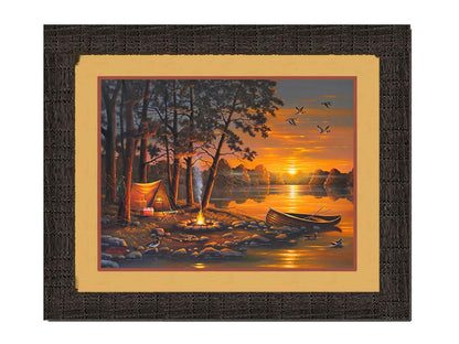 A painting of a small woods campsite at the edge of a lake. A boat is docked on the rocks of the shore, and a campfire is lit nearby. Some ducks swim in the lake as others fly overhead before the setting sun. Printed on paper, matted, and framed.