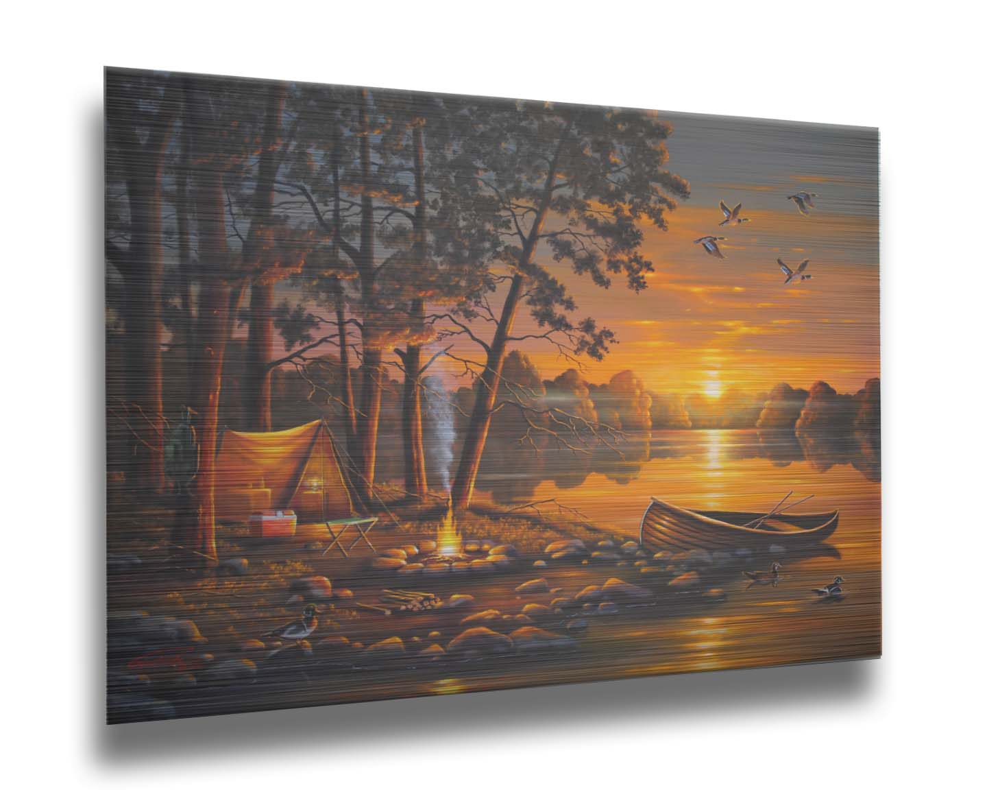 A painting of a small woods campsite at the edge of a lake. A boat is docked on the rocks of the shore, and a campfire is lit nearby. Some ducks swim in the lake as others fly overhead before the setting sun. Printed on metal.