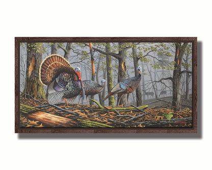 A painting of three turkeys walking through the woods on leaf-covered ground. In the distance, grazing deer and a hunting stand are visible through the fog. Printed on canvas in a float frame.