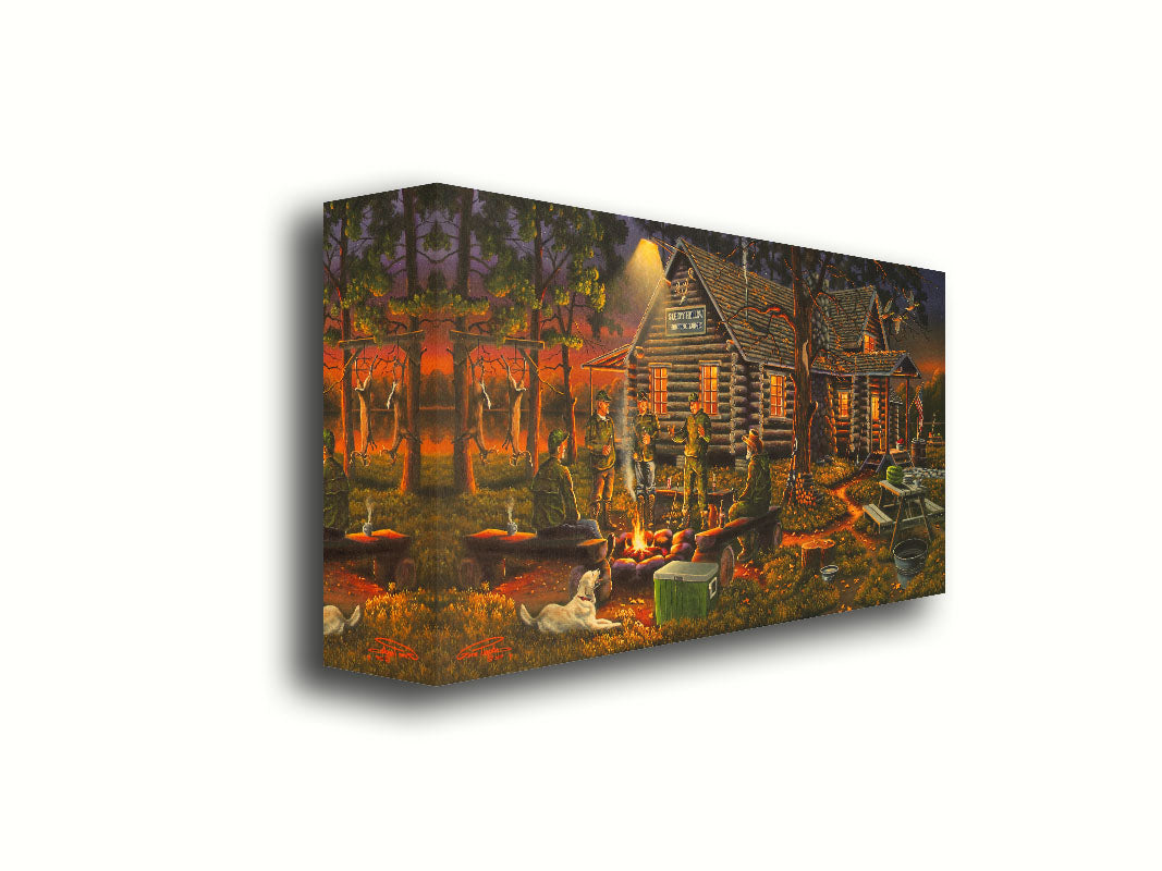 A painting of a group of hunters and their dog, gathered around a campfire at sunset. Behind them is a log cabin hunting lodge, and deer hang from skinning racks in the distance. Printed on canvas.