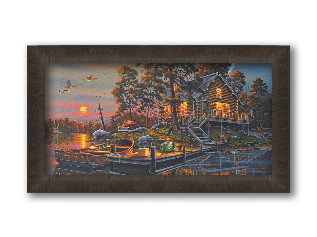 A painting of a lakeside cabin with a nearby dock. A fishing boat is tied up, and supplies are nearby to go fishing. The sunset is reflecting off the water. Printed on canvas and framed.