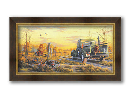 A painting of a truck parked on a dirt road through a vibrant yellow field. A hunting dog lies in the back, watching pheasants nearby. Printed on canvas and framed.