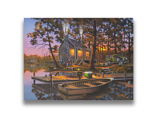 A painting of a lakeside log cabin hunting lodge at sunset. A rowboat is tied to the nearby dock, where shotguns are leaned against a cooler. Printed on canvas.