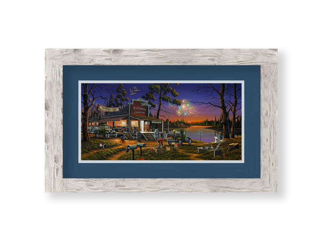 A landscape painting of a lakeside café at sunset, overlooking a colorful fireworks display over the lake on Veterans Day. People sit in the grass watching the excitement.Printed on paper, matted, and framed.