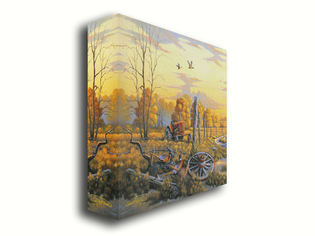 A landscape painting of autumn trees and a field. A tractor, a broken wheel, and a broken fence post add extra character to the scene. Pheasants sit in the foreground and ducks fly overhead. The sky and field are as golden yellow as the trees, in the morning light. Printed on canvas.