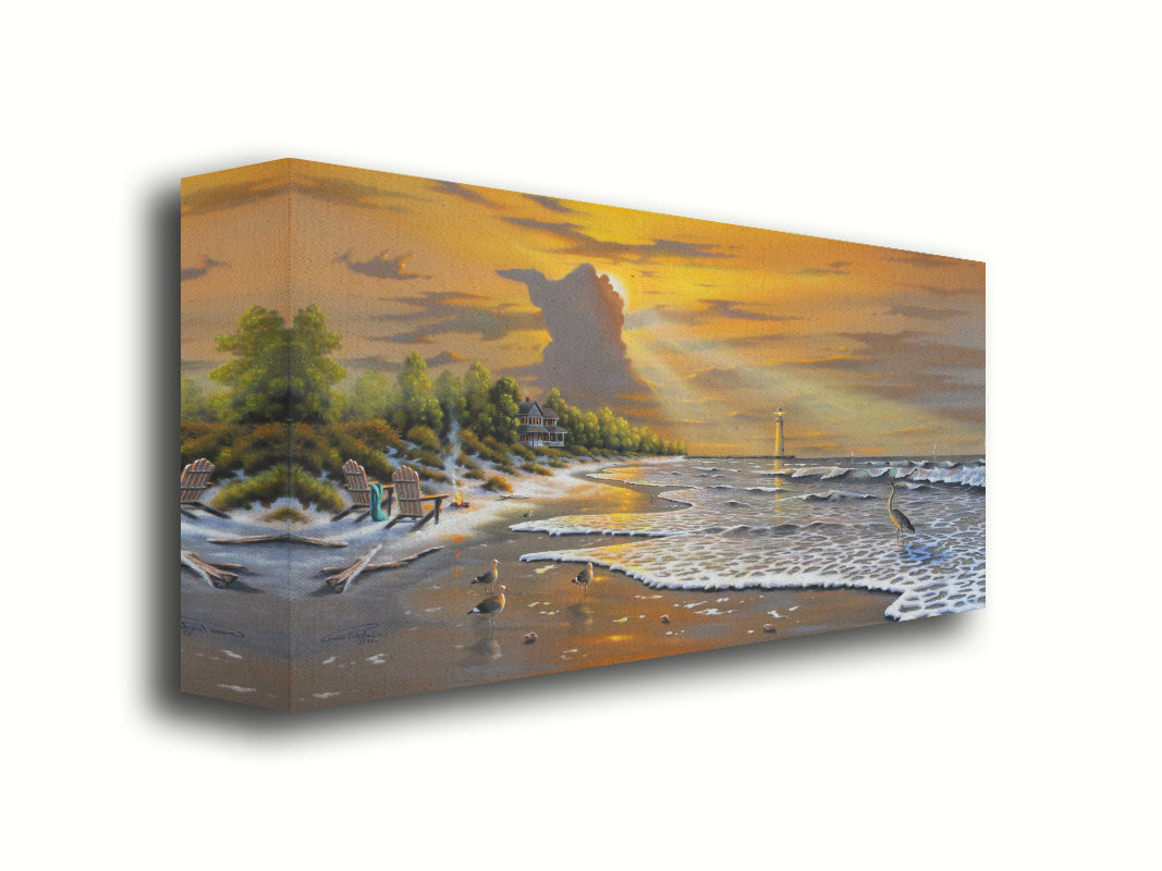 A painting of a beach scene, with a house and lighthouse in the distance. Birds trot along the sand, and the sun peeks from behind a cloud, shining beams of light down on them. Printed on canvas.