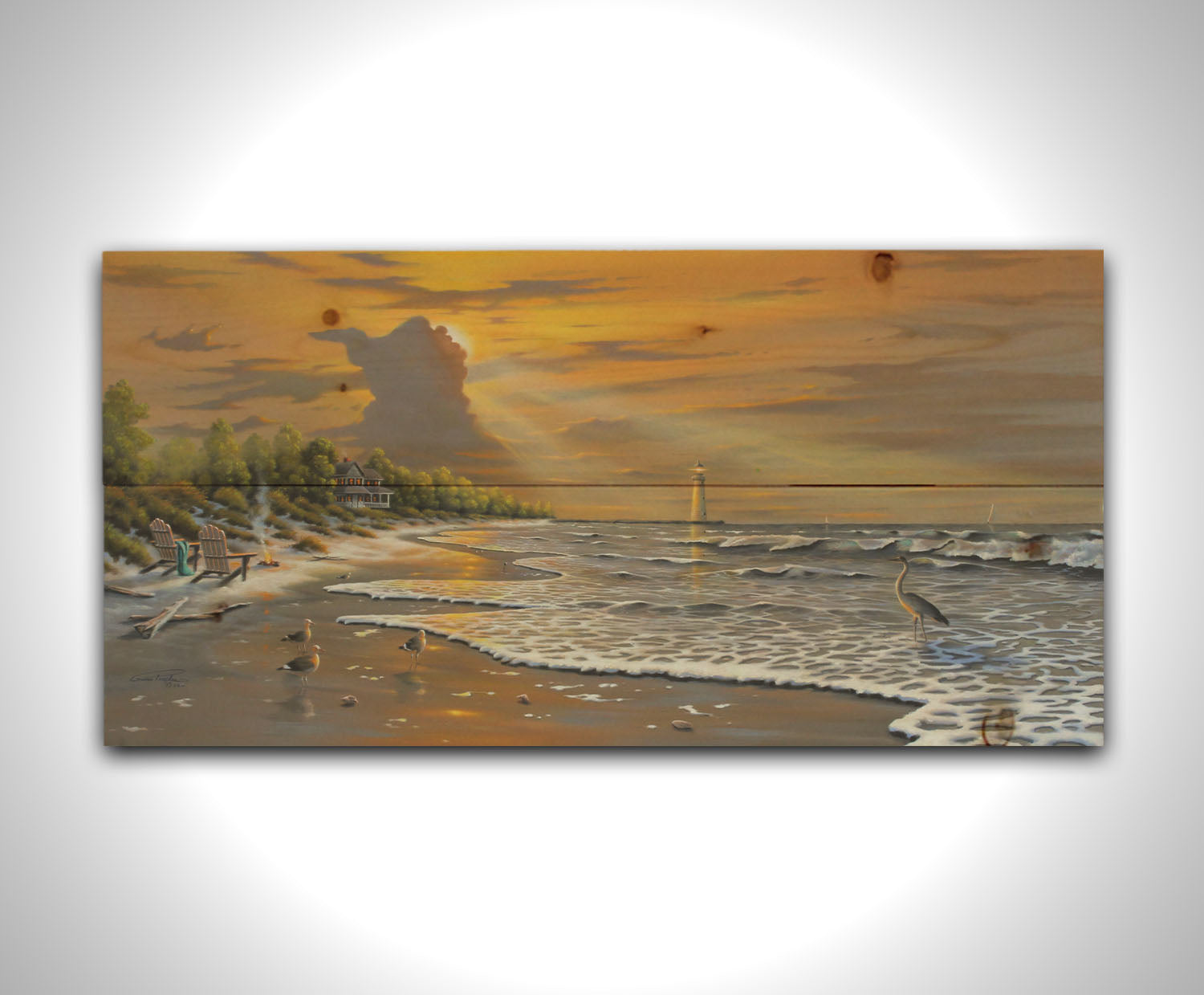 A painting of a beach scene, with a house and lighthouse in the distance. Birds trot along the sand, and the sun peeks from behind a cloud, shining beams of light down on them. Printed on a wood pallet.