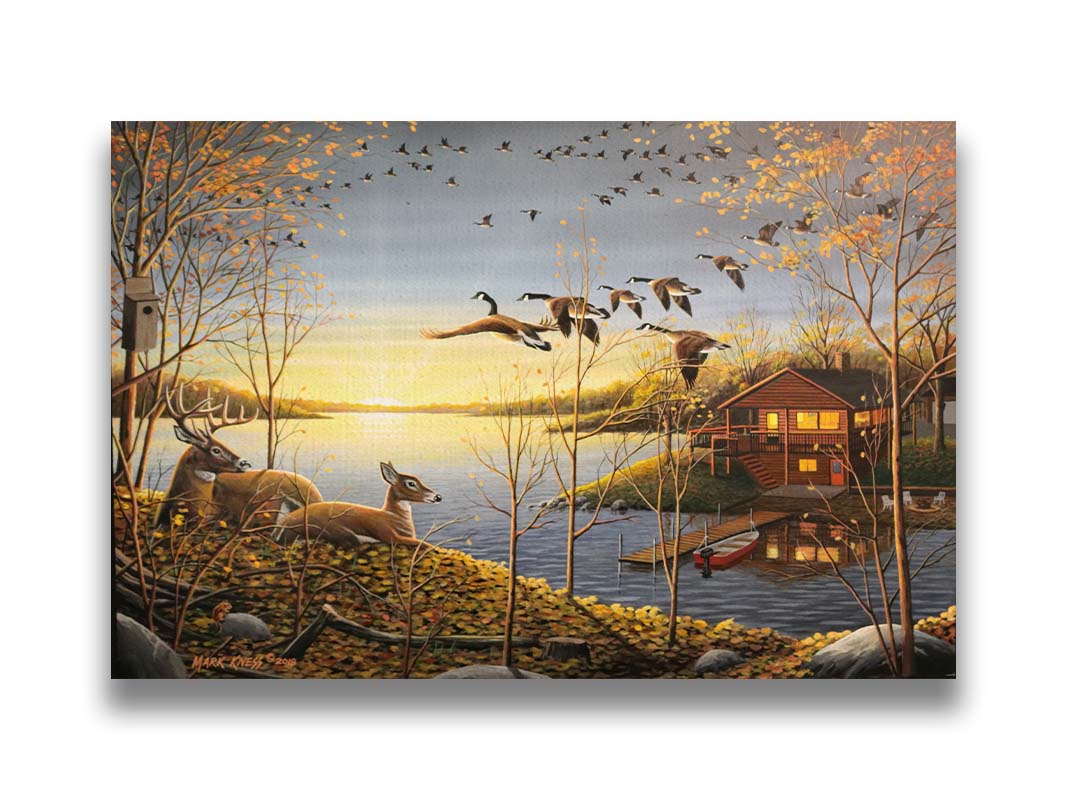 A painting of a lake scene by Mark Kness. Deer overlook a lakehouse as geese fly overhead at sunrise. Printed on canvas.