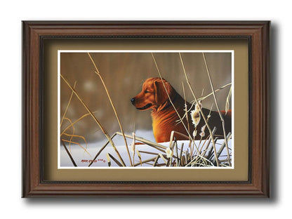 A portrait painting of a golden retriever, surrounded by a snowy landscape with brown, dead plants frozen in the winter cold. Printed on paper, matted, and framed.