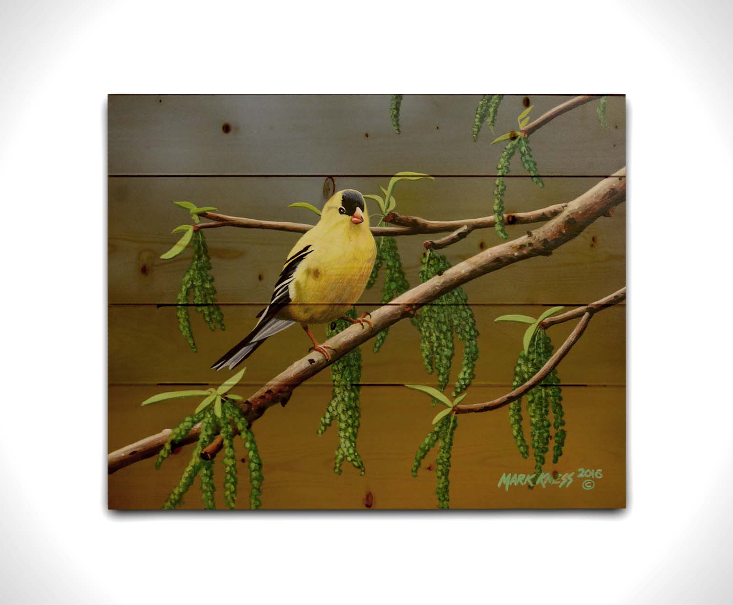 A painting of an American Goldfinch bird perched on a twig. Its bright yellow feathers stand out against the brown and green of the tree branch. Printed on a wood pallet.