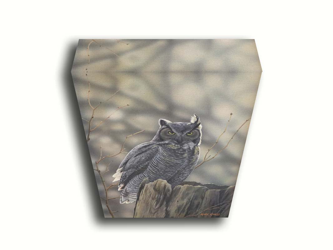 A painting of a great horned owl perched atop a log. Printed on canvas.