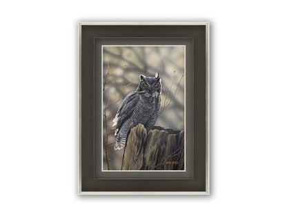 A painting of a great horned owl perched atop a log. Printed on paper, matted, and framed.