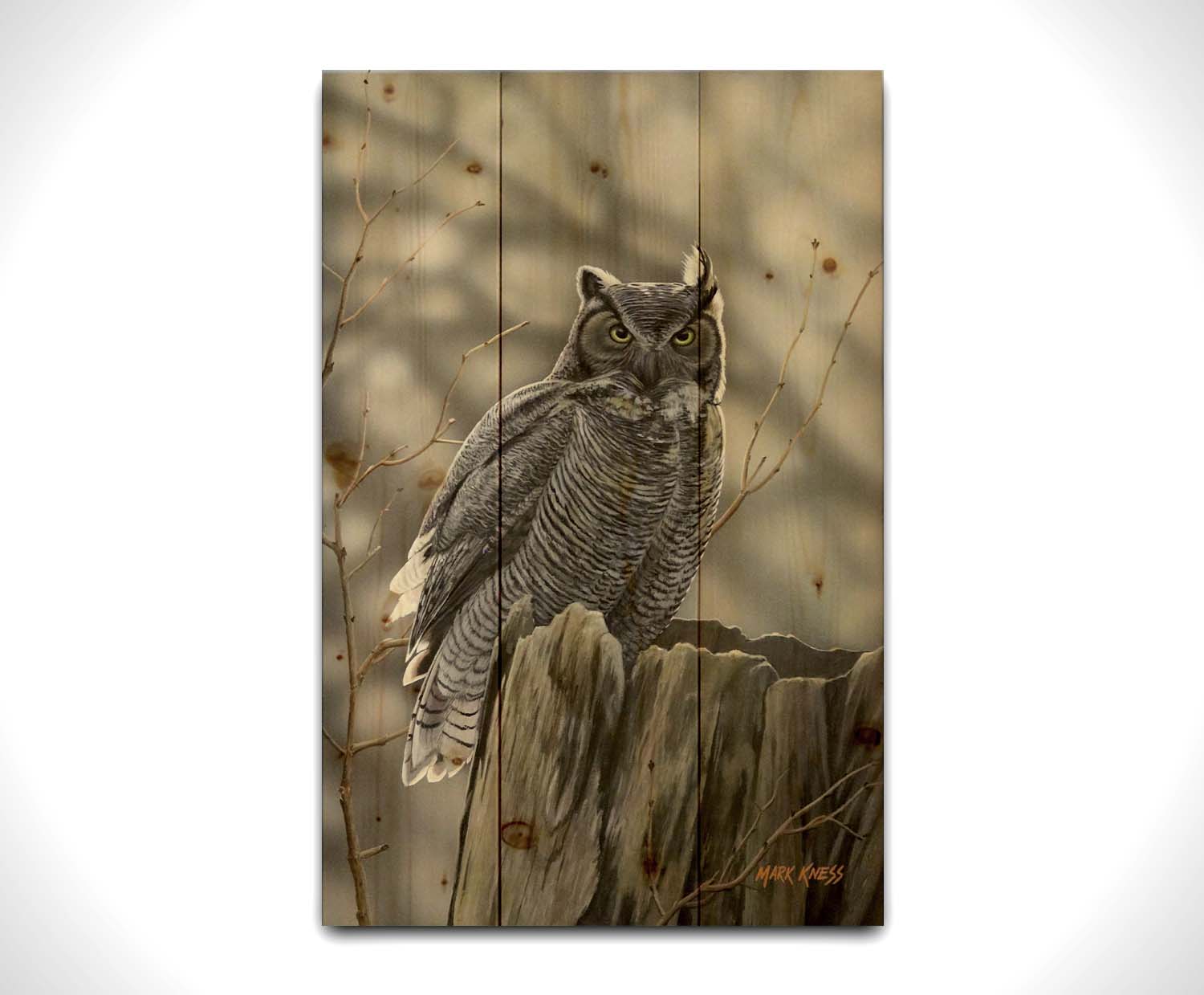 A painting of a great horned owl perched atop a log. Printed on a wood pallet.