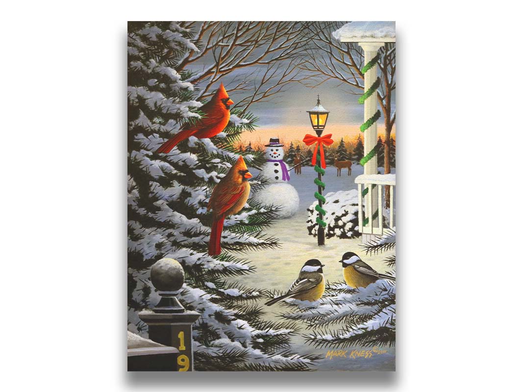 A painting of cardinals and chickadees perched on snowy evergreen branches. In the background, a festively decorated streetlamp illuminates a nearby snowman. Deer look on in the distance. Printed on canvas.