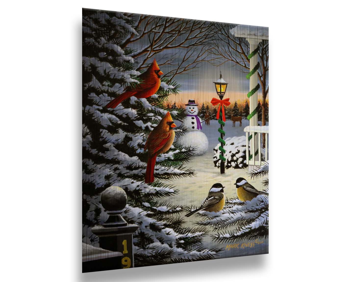 A painting of cardinals and chickadees perched on snowy evergreen branches. In the background, a festively decorated streetlamp illuminates a nearby snowman. Deer look on in the distance. Printed on metal.