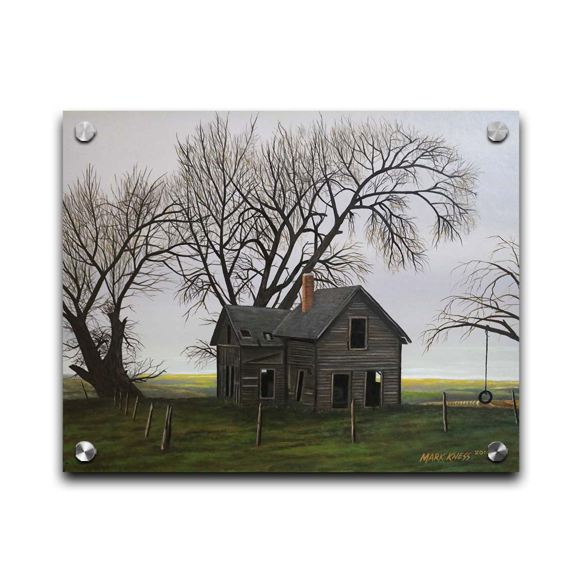 A painting of an old, abandoned house. There is a tire swing hanging on a bare tree in the yard, and the fields in the background are buried in fog. Printed on acrylic.