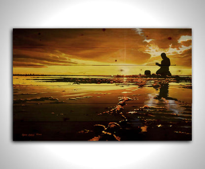 A painting of icy waters reflecting the sunset, with a fisherman silhouetted in the light, sitting with his fishing pole. Printed on a wood pallet.