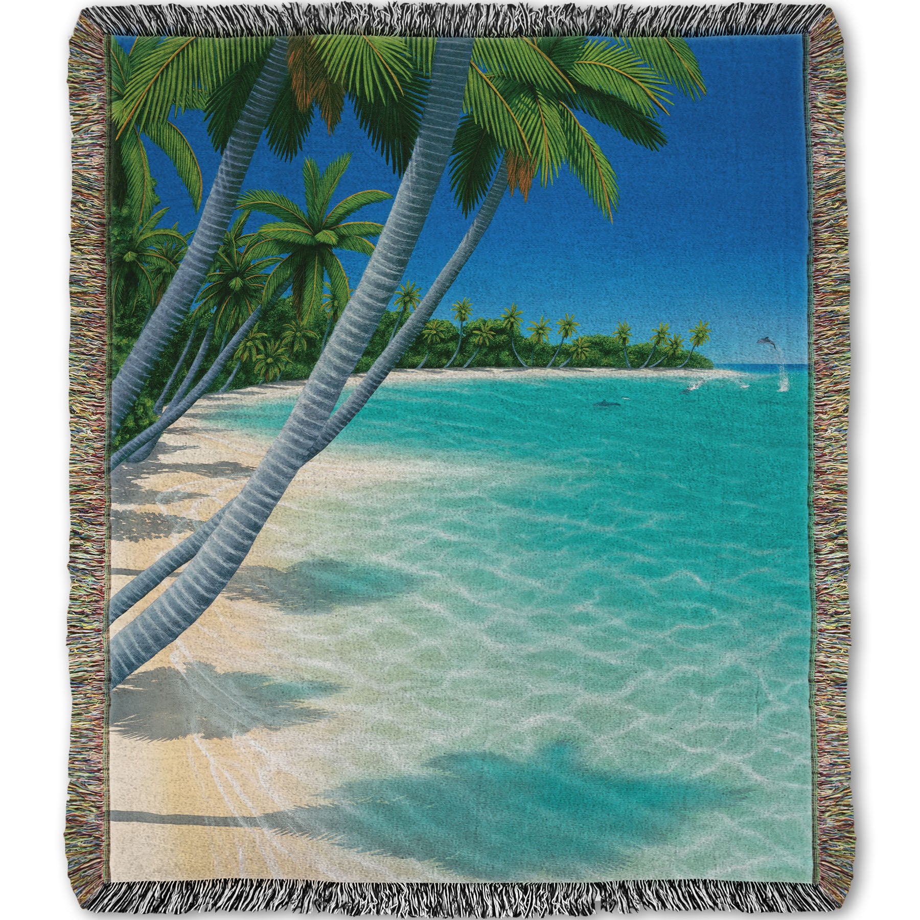 A woven throw blanket designed with a vibrant painting of a landscape beach scene, with leaning palm trees and clear waters. Leaping dolphins swim in the distance, approaching the shore.