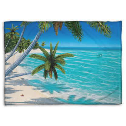 A coral fleece throw blanket designed with a painting of a white sand beach with growing palm trees and conch shells. Sea turtles swim through the clear blue waters.