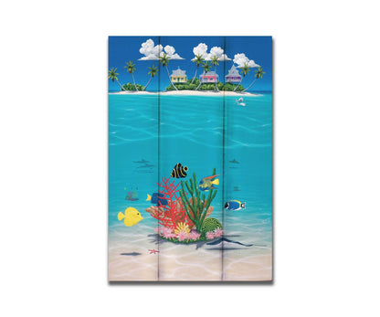 A vibrant painting of an island ocean scene. Three homes sit on an island in the background, while the foreground shows tangs, angelfish, dolphins, starfish, sea turtles, and more beneath the waves alongside corals. Printed on a box board.