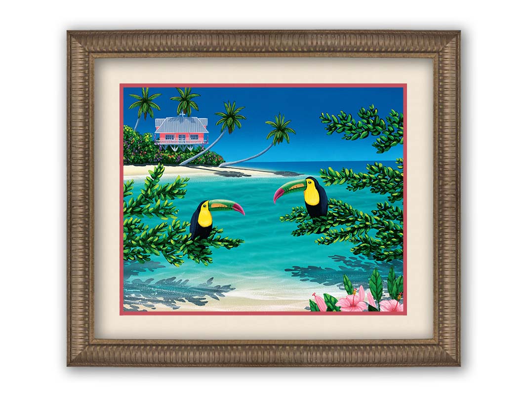 A vibrant painting of an island beach scene, featuring two toucans perched on plants in the foreground, and a bright house on stilt foundations in the background. Printed on paper, matted, and framed.