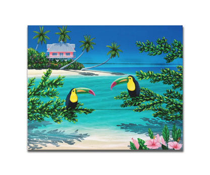 A vibrant painting of an island beach scene, featuring two toucans perched on plants in the foreground, and a bright house on stilt foundations in the background. Printed on a box board.