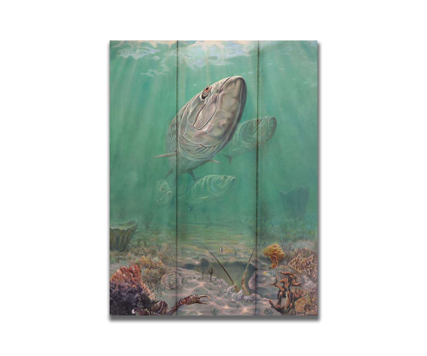 A painting of a school of tarpon swimming above a lively sea floor filled with pufferfish, crabs, lobsters, and rockfish. Beams of light penetrate the water's surface, giving the scene a dreamlike quality. Printed on a box board.