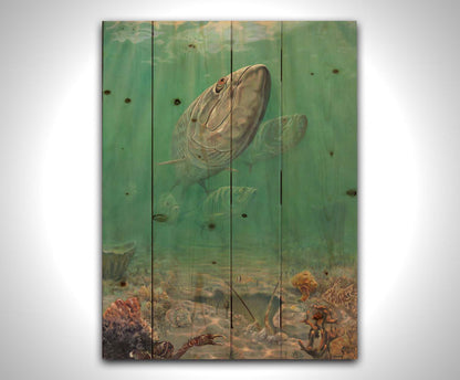 A painting of a school of tarpon swimming above a lively sea floor filled with pufferfish, crabs, lobsters, and rockfish. Beams of light penetrate the water's surface, giving the scene a dreamlike quality. Printed on a wood pallet.