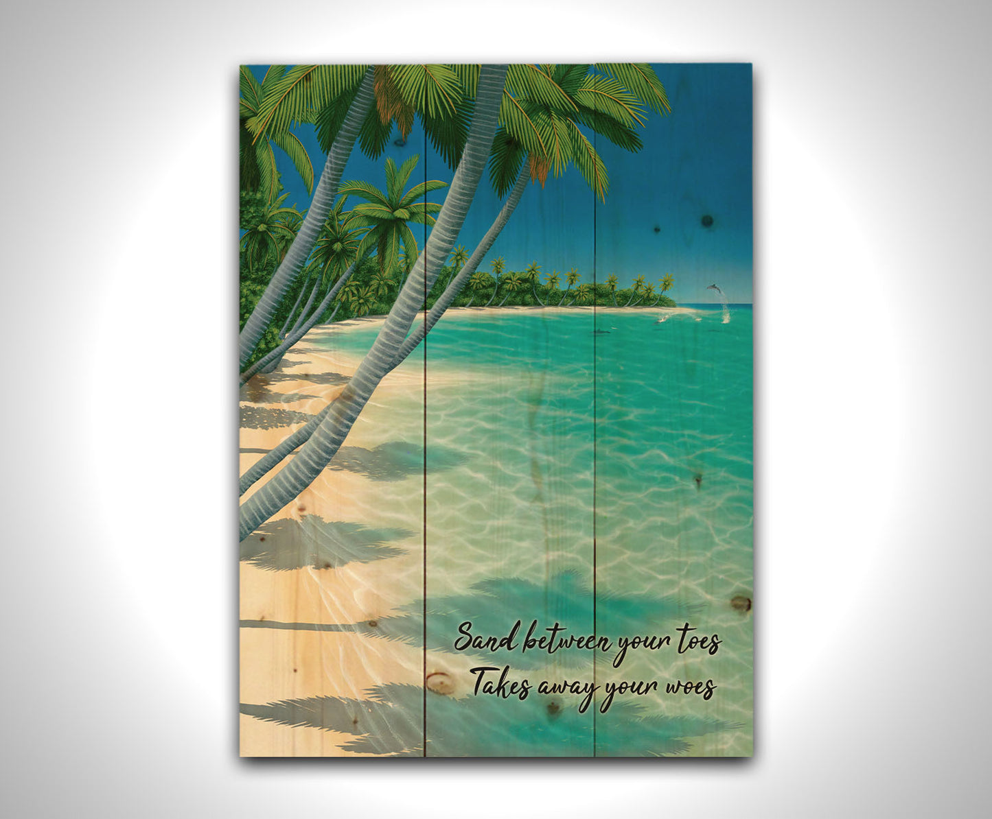 A vibrant painting of a landscape beach scene, with leaning palm trees and clear waters. Leaping dolphins swim in the distance, approaching the shore. Printed on a wood pallet.