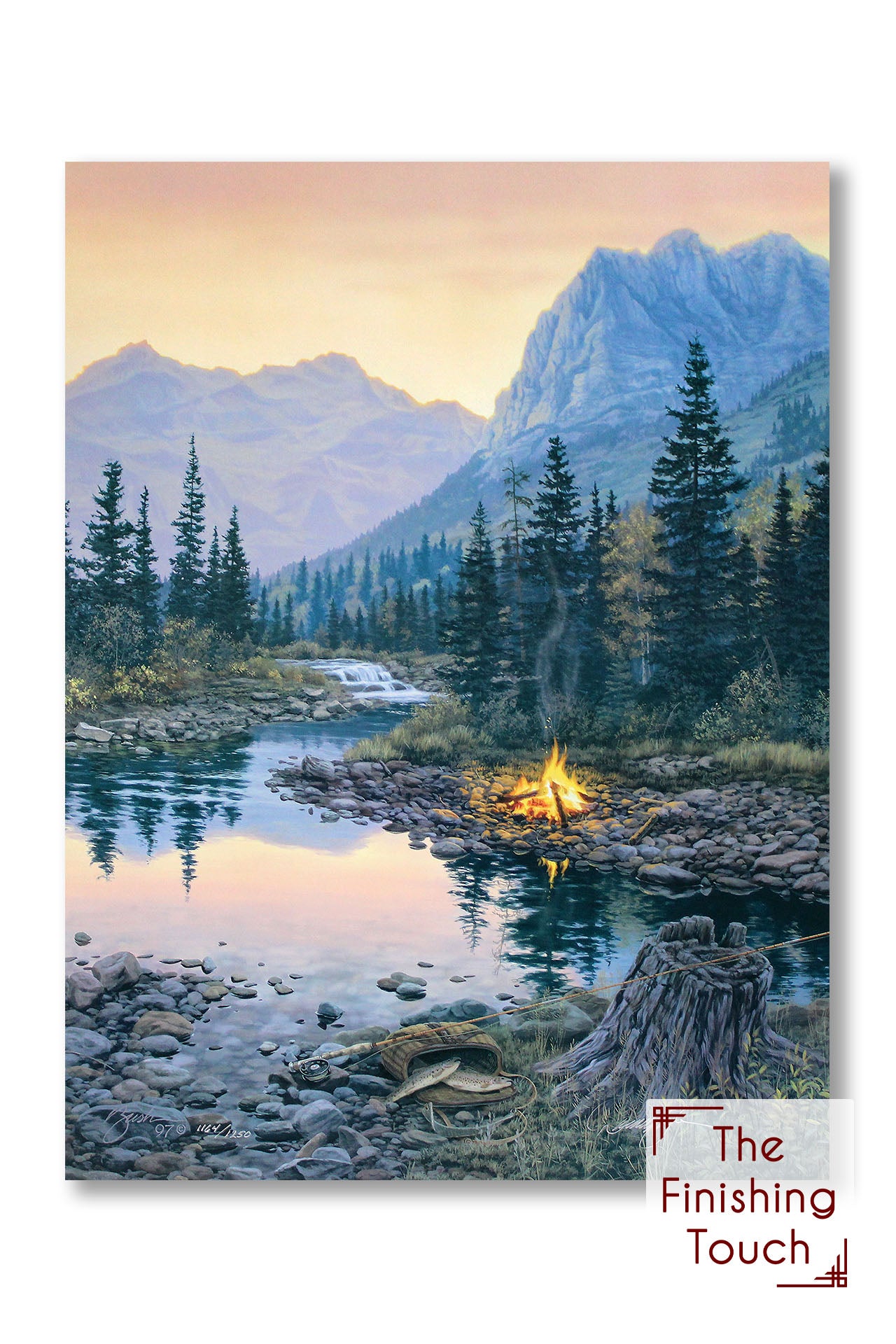 A painting of a fishing spot on a mountain stream. A fishing pole and basket lean against a stump across from a campfire.