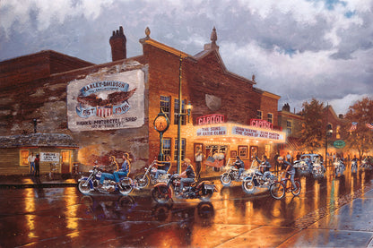 A painting of a group of bikers riding their motorcycles down a town road past a Harley Davidson motorcycle shop, a movie theater, and other shops. The sky is cloudy, and the shop lights reflect off the damp pavement.