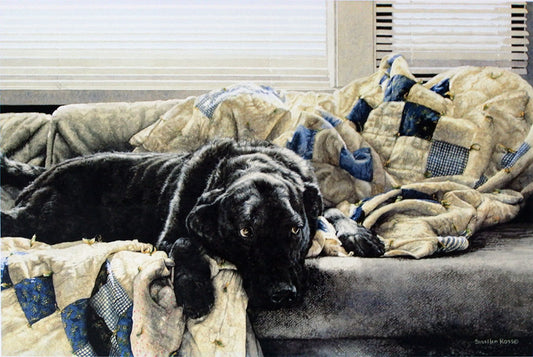 A painting of a black lab dog resting on a cozy couch, surrounded by a plush quilt.