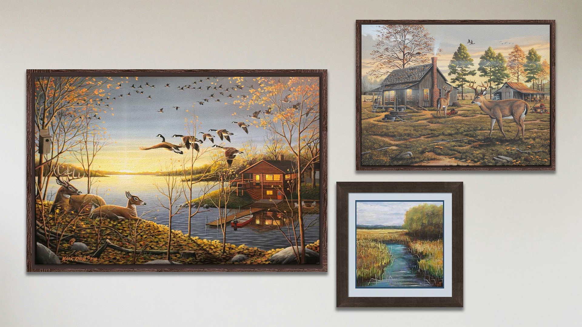 A collage of art in the luxury Dream Cabin package, including a float framed painting of a stream through a grassy field and two float framed paintings of a woodsy cabin landscaped.